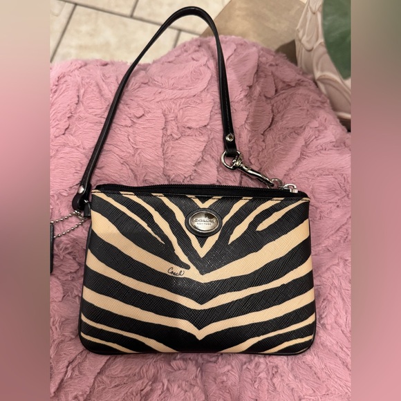 Coach Handbags - COACH PEYTON ZEBRA PRINT COATED CANVAS WRISTLET BLACK & TAN